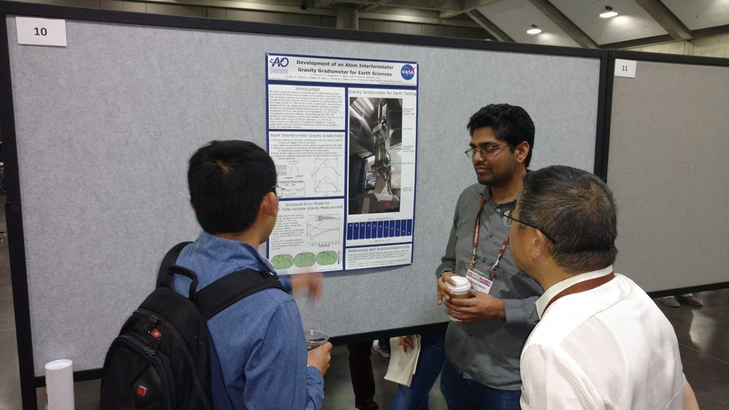 AOSense Physicist Akash Rakholia (center) presenting a poster at DAMOP 2017